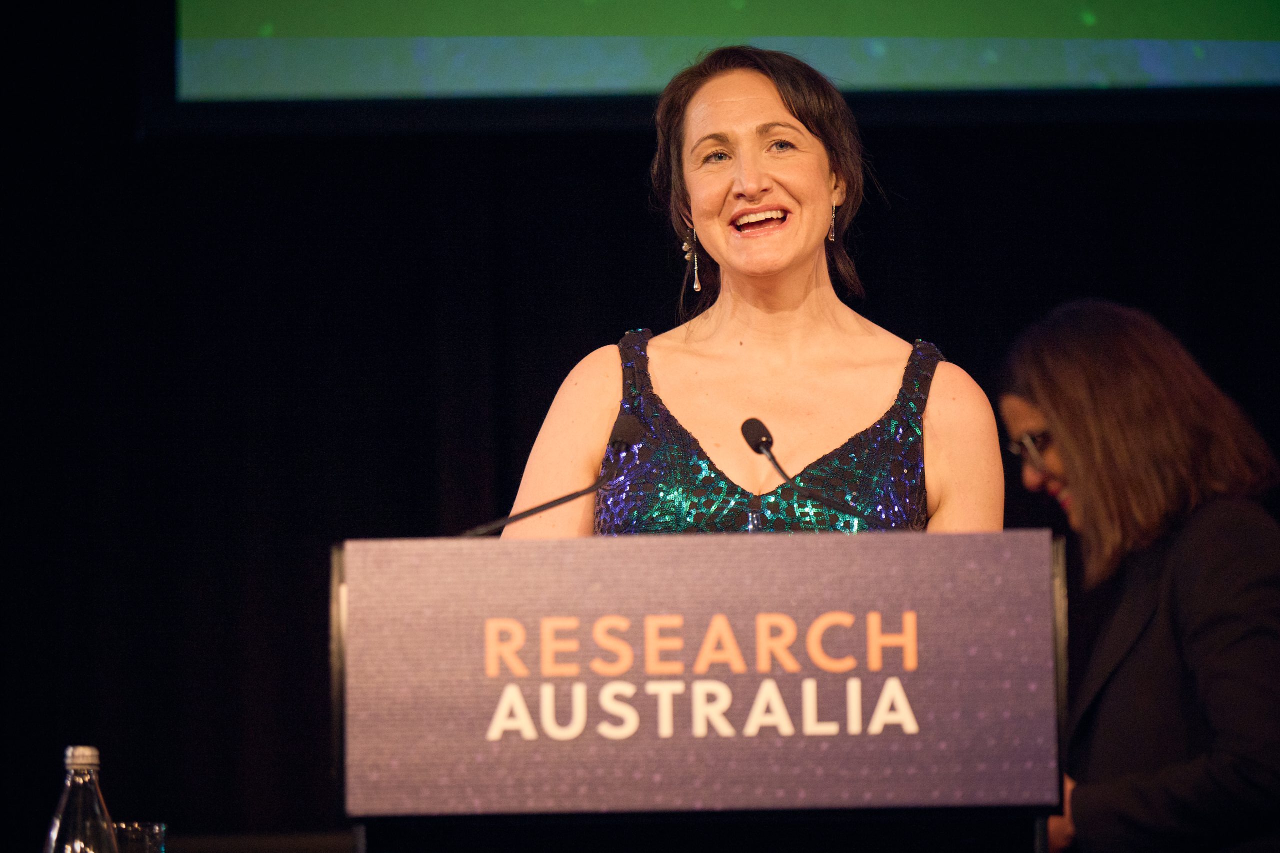 Dr Jane Tiller speaking on stage at the Research Australia Awards